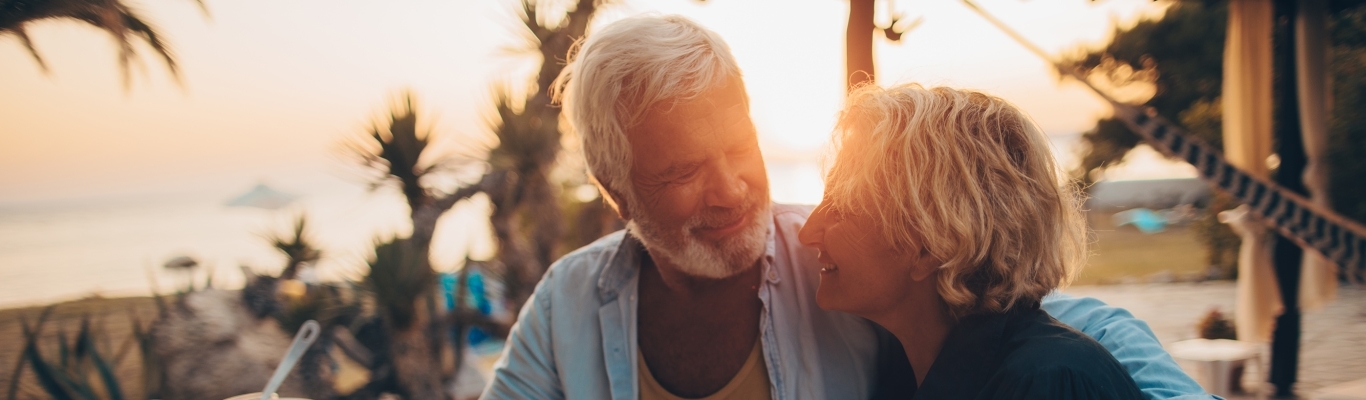 Senior Couple Having Dinner on Beach